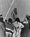 Nellie Denning with school children and tipi poles outside Candelaria Hall by Dan Wooley