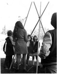 Children looking at tipi outside the Anthropology Museum