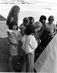 Nellie Dunning with students looking at model tipi