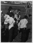 Scott or Jefferson Elementary School children playing hoop and arrow game by Dan Wooley