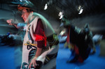 Tlingit Tribe members dance before a recently returned Bear Clan Totem during a welcoming ceremony in Angoon, Alaska, November 1, 2003 by Kevin Moloney