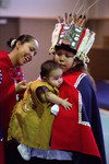 A Tlingit baby is admired during a welcoming ceremony for a recently returned Bear Clan Totem in Angoon, Alaska, November 1, 2003 by Kevin Moloney