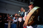 Members of the Tlingit Nation sing for a recently returned Bear Clan Totem during a welcoming ceremony in Angoon, Alaska, November 1, 2003 by Kevin Moloney