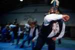 Daniel Brown dances in celebration of a recently returned Bear Clan Totem during a welcoming ceremony in Angoon, Alaska, November 1, 2003 by Kevin Moloney
